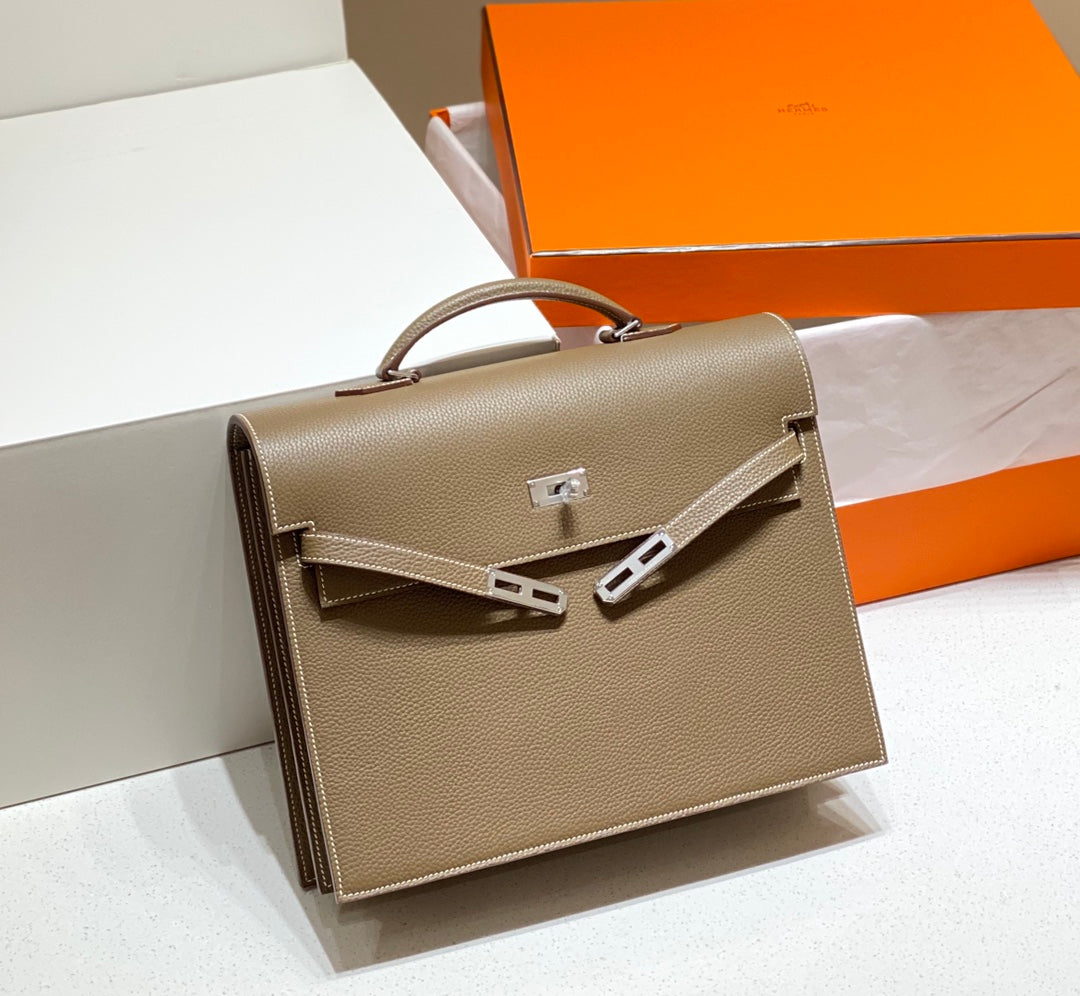 KELLY DEPECHES 34 BRIEFCASE IN ETOUPE TOGO CALFSKIN SILVER HARDWARE